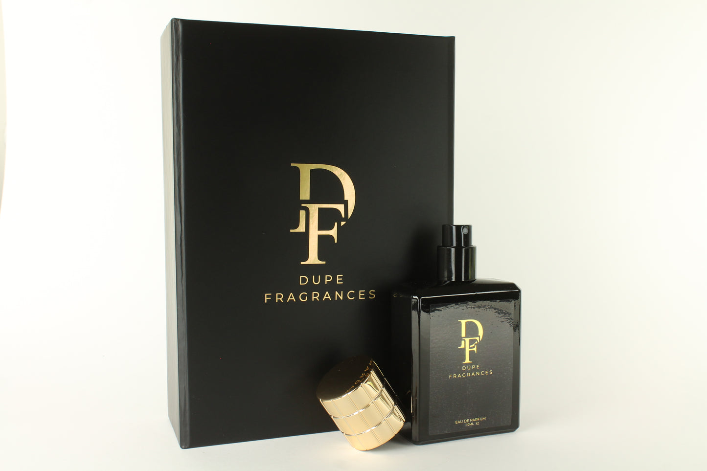 Dupe Fragrances packaging and perfume bottle on a white background