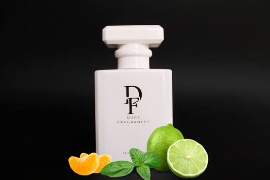 Citrus Creed by Dupe Fragrances White perfume bottle inspired by Lime Basil & Mandarin by Jo Malone with limes on a black background