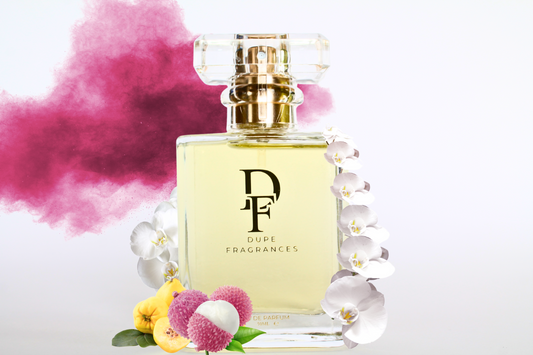 50ml dupe fragrances perfume Dreamland Bliss inspired by Fantasy by Britney Spears. Clear bottle gold label on pink mist background, orchid, lychee and quince