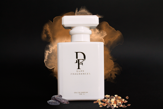 Smoke &amp; Suede (inspired by Myrrh &amp; Tonka by Jo Malone)Two perfume bottles with 'Dupe Fragrances' branding on a dark background