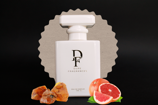 Studio_Air_inspired_by_Bergamote_22_by_Le_Labo Perfume bottle with 'Dupe Fragrances' branding, surrounded by fruits on a dark background