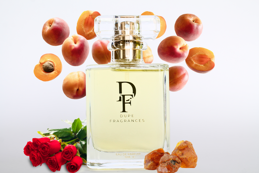 50ml dupe fragrance perfume Skin Scent inspired by Narciso Rodriguez for Her. Clear bottle with gold label on background of peaches